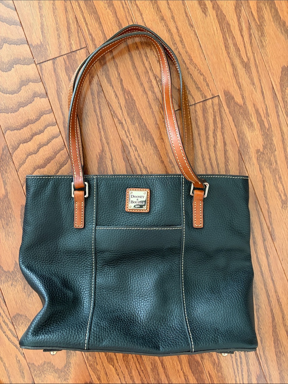 Dooney & Bourke Black Pebbled Leather purse with Brown Trim